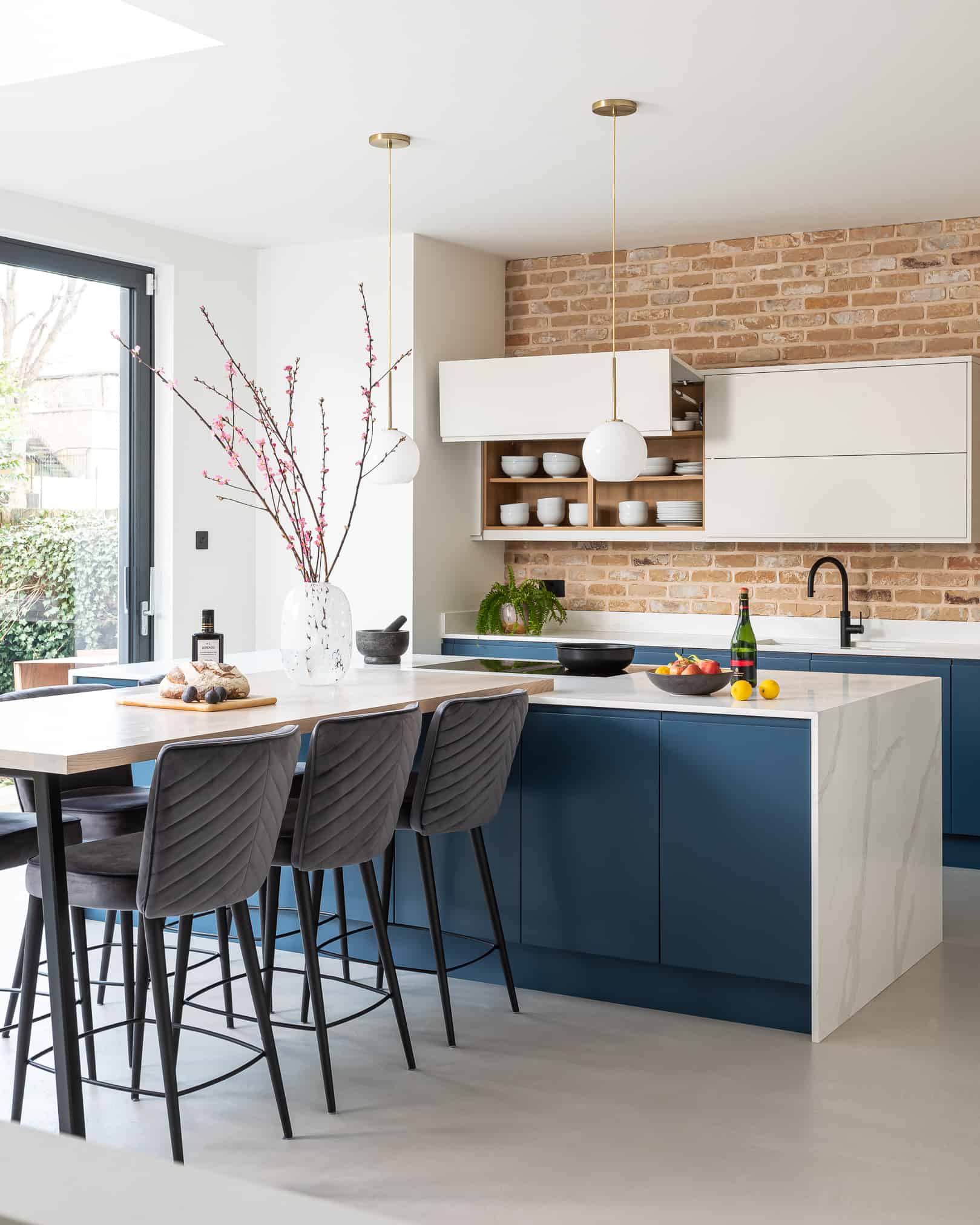 John Lewis of Hungerford pure luxury handmade minimalist kitchen with blue cabinetry and kitchen island with marble worktops