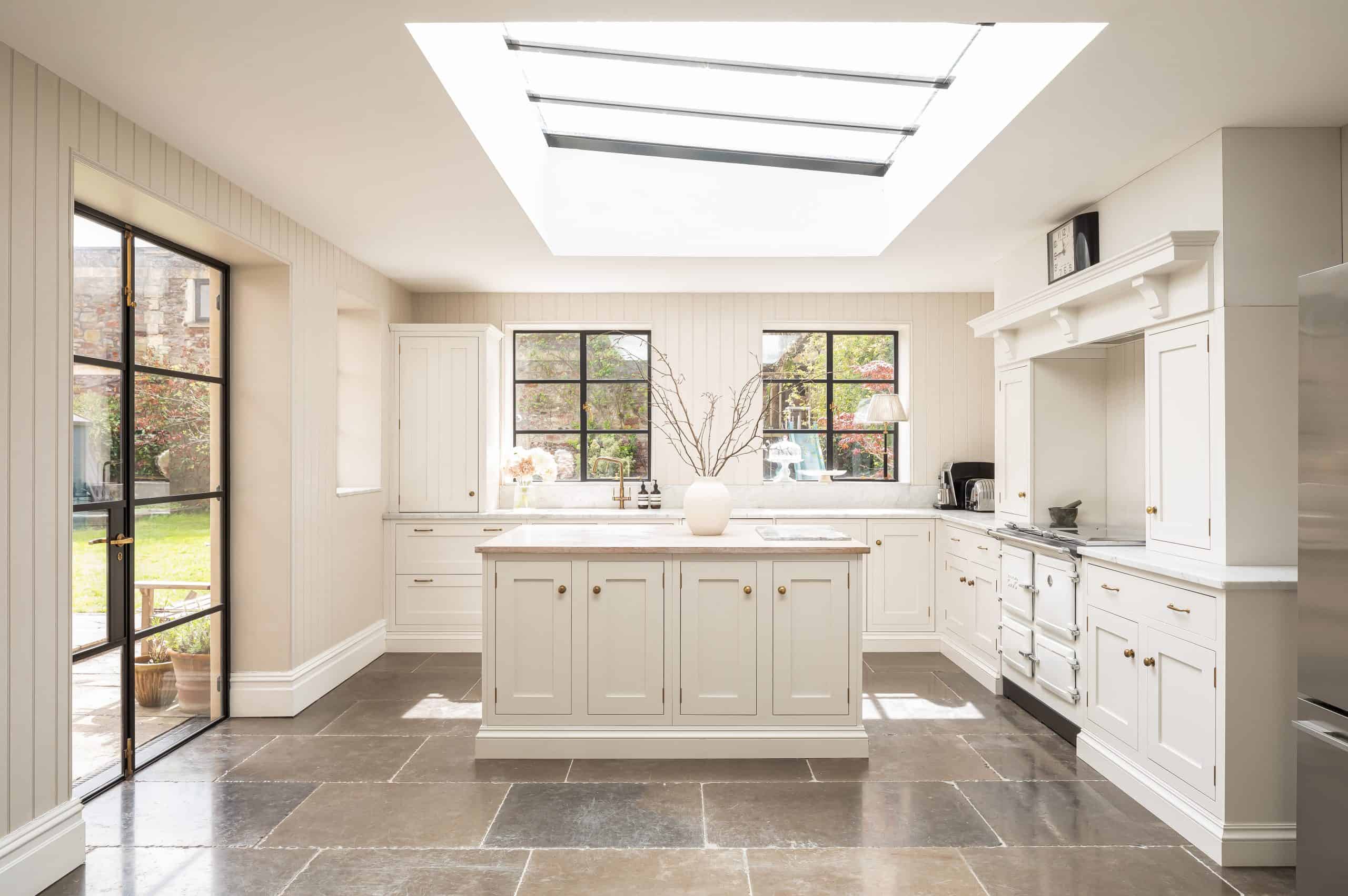 John Lewis of Hungerford bespoke luxury Shaker kitchen in white with stone flooring